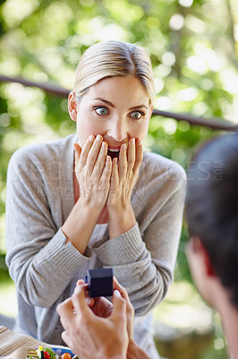 Buy stock photo Woman, surprise and couple with ring in proposal for commitment, future and engagement question. Shock, romance and boyfriend with jewellery in box for offer, conversation and asking for marriage