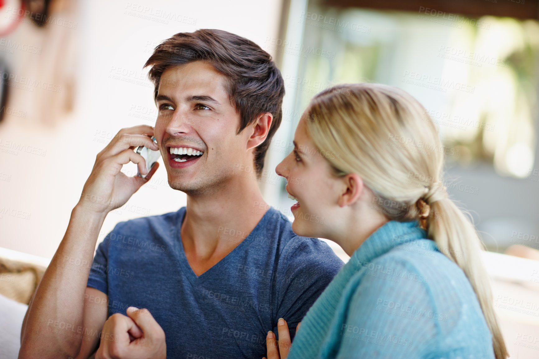 Buy stock photo Funny, love and phone call with couple in living room of home together for comedy or communication. Conversation, humor or laughing with happy man and woman talking on mobile in apartment for joke