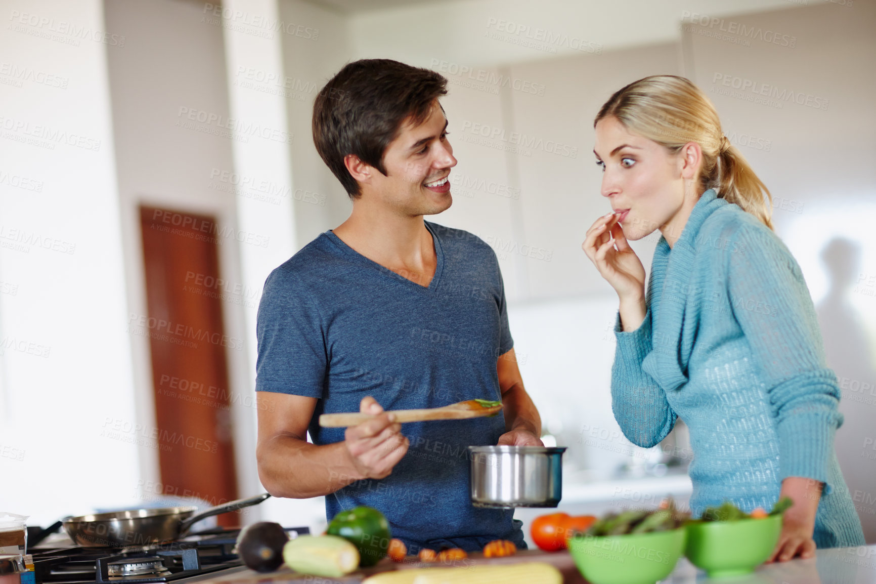 Buy stock photo Couple, kitchen and taste cooking in home for dinner, plans and happy in relationship or marriage. Woman, man and partner in together in meal, preparation and nutrition for bonding, diet and food