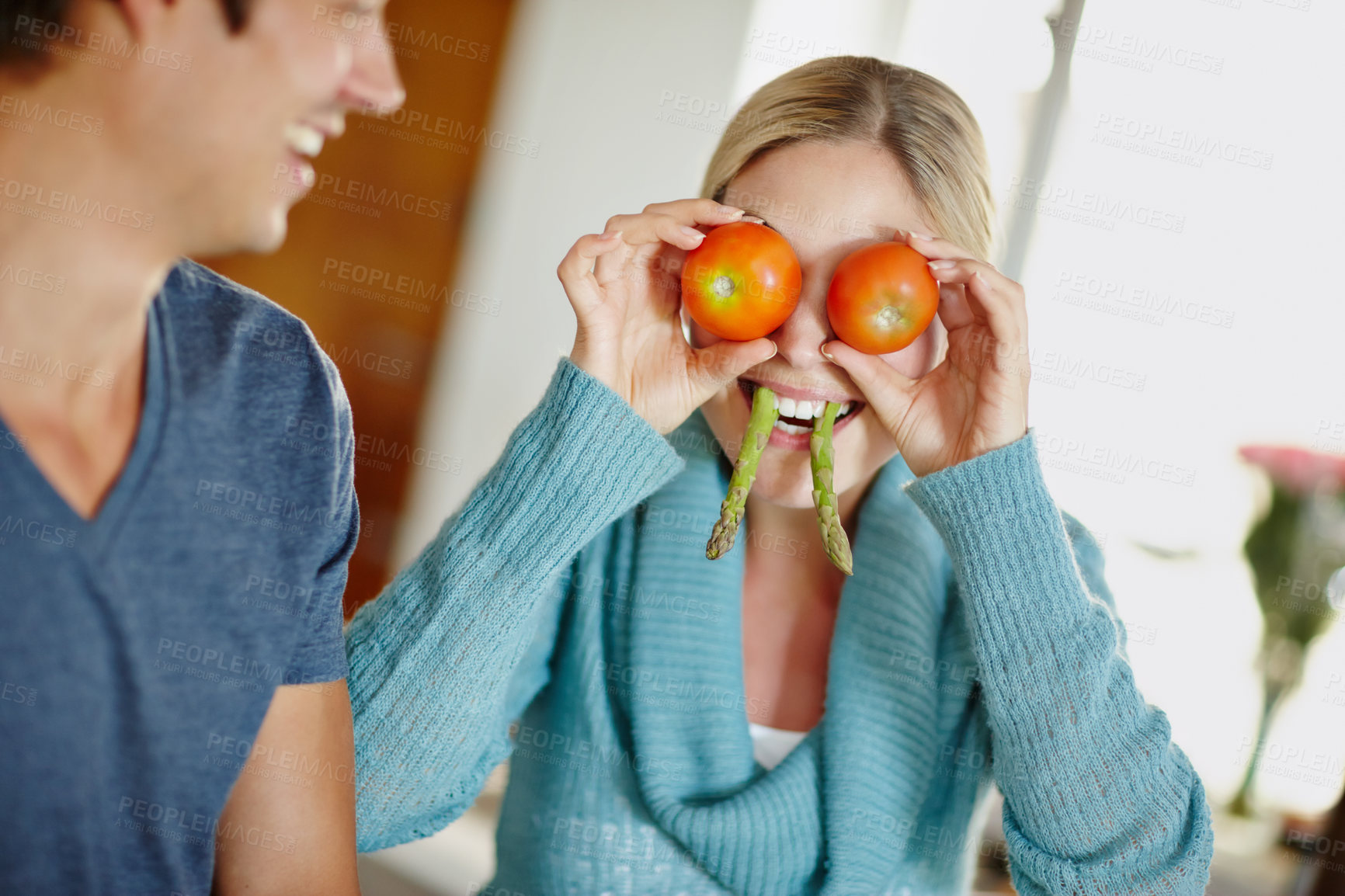 Buy stock photo Laughing, cooking and couple in kitchen, silly and meal prep in morning, joke or smile in apartment. Relationship, man and affection for woman, comedy or goofy with vegetables or healthy food in home