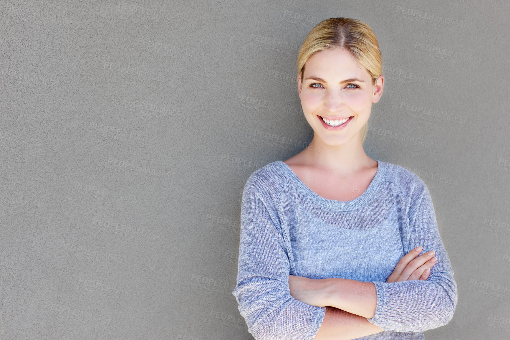 Buy stock photo Woman, happy portrait and outdoor by grey wall with mockup space, gen z and modern fashion. Home, smile and person from Switzerland with arms crossed, calm and confidence with casual and clothes