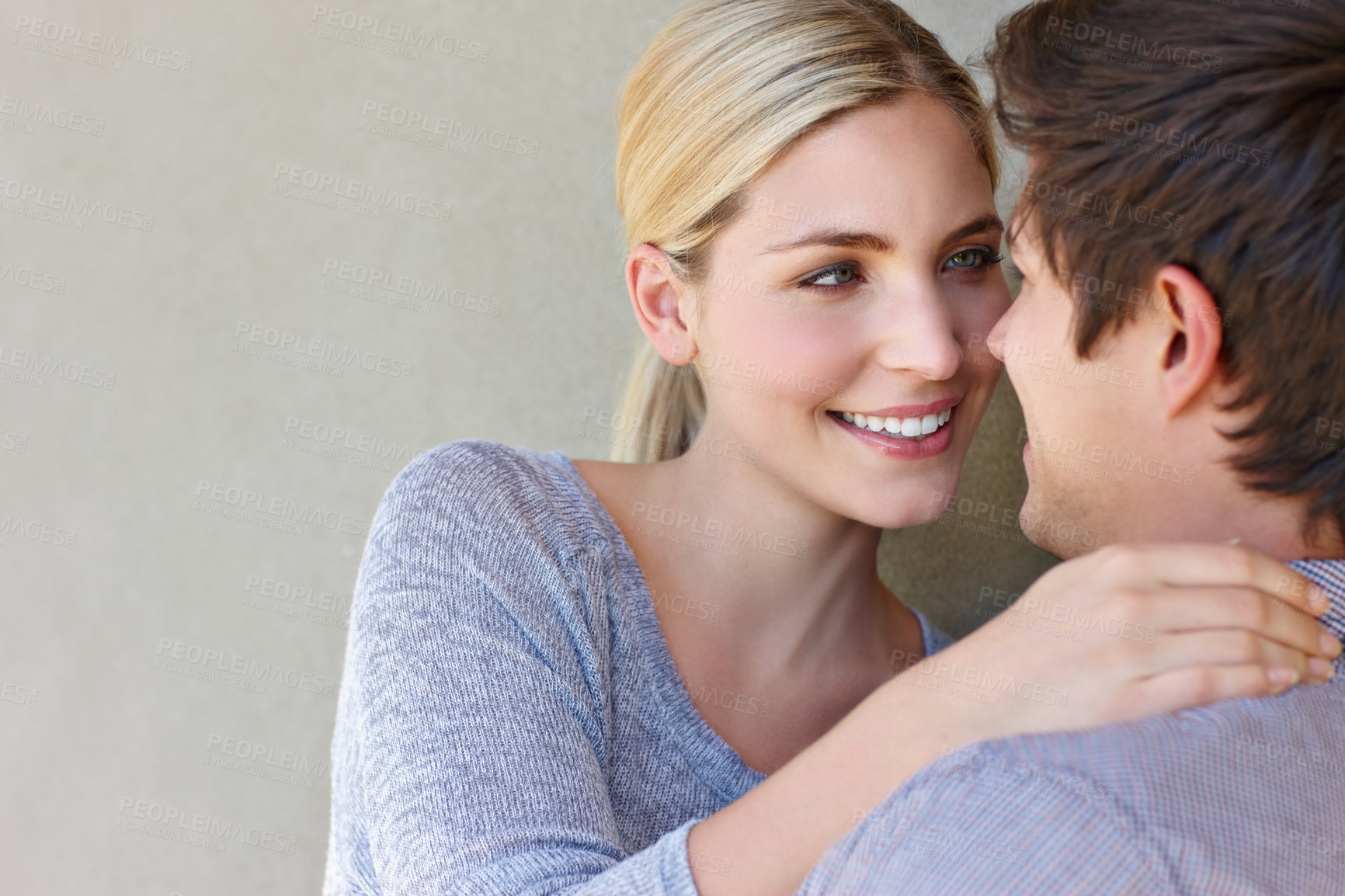 Buy stock photo Couple, love and embrace on background with space for bonding, hug and relationship outdoor. Man, woman and happy care, date and romance connection with trust, smile or relax together with support