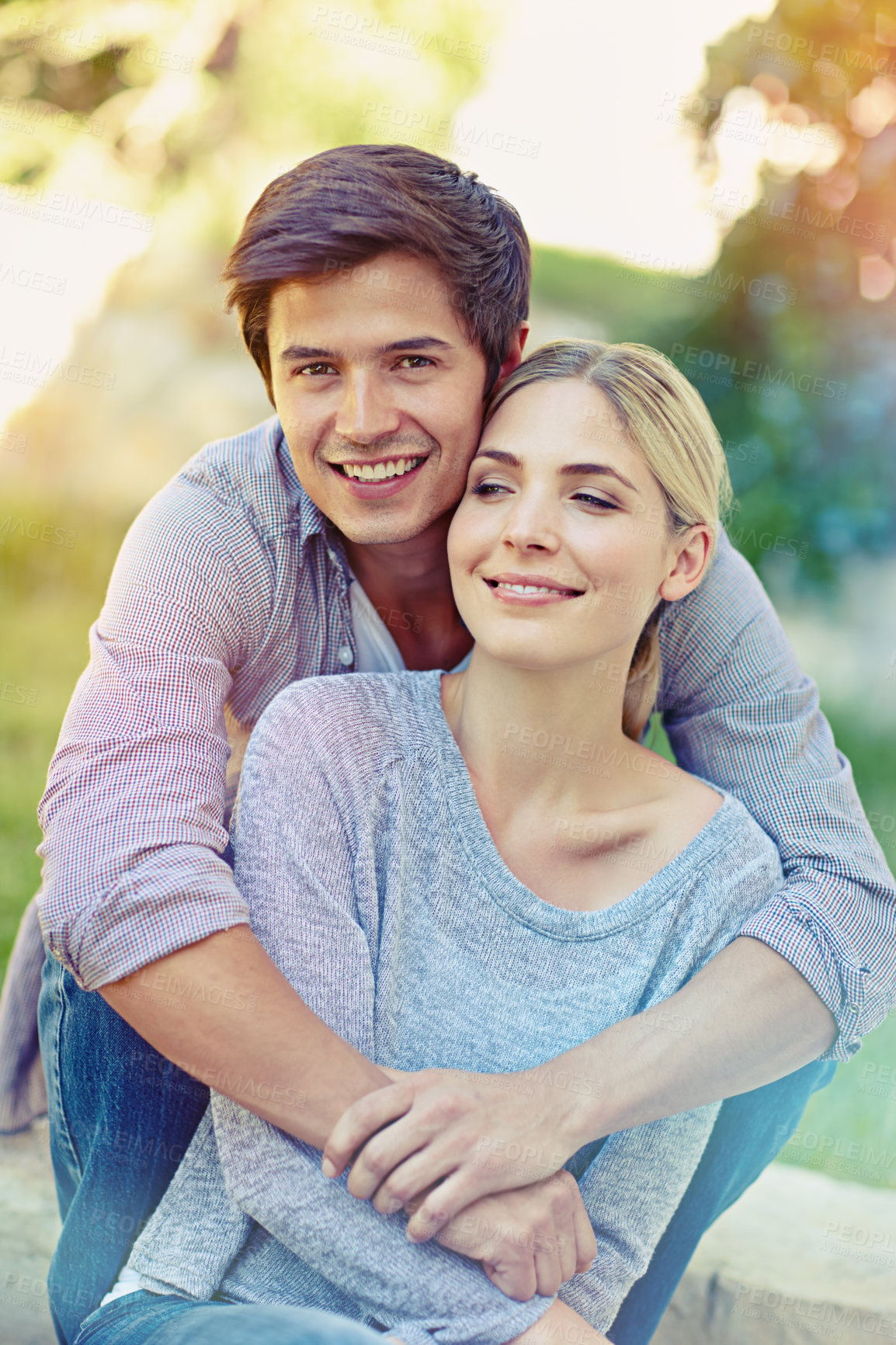 Buy stock photo Portrait of a happy young couple enjoying an affectionate moment together outdoors