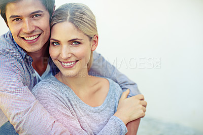 Buy stock photo Portrait of a happy young couple enjoying an affectionate moment together outdoors