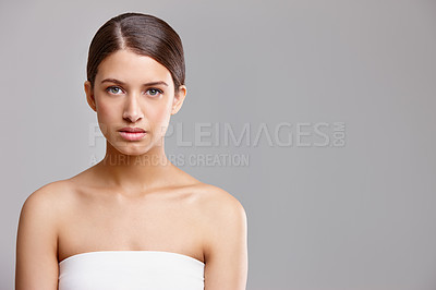 Buy stock photo Portrait, shine and woman with cosmetics, skincare or dermatology on gray studio background. Face, person or model with grooming routine, mockup space or aesthetic with glow, healthy skin or wellness