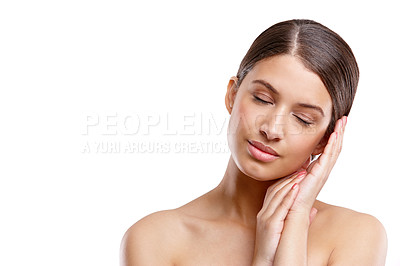 Buy stock photo Cropped studio shot of a beautiful young woman posing with her eyes closed