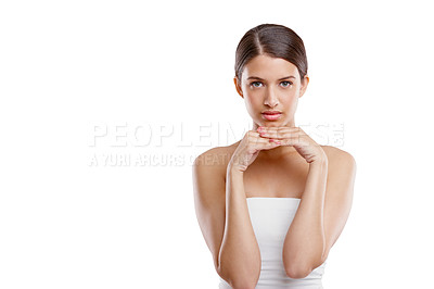 Buy stock photo Studio portrait of a young woman with beautiful skin posing against a white background