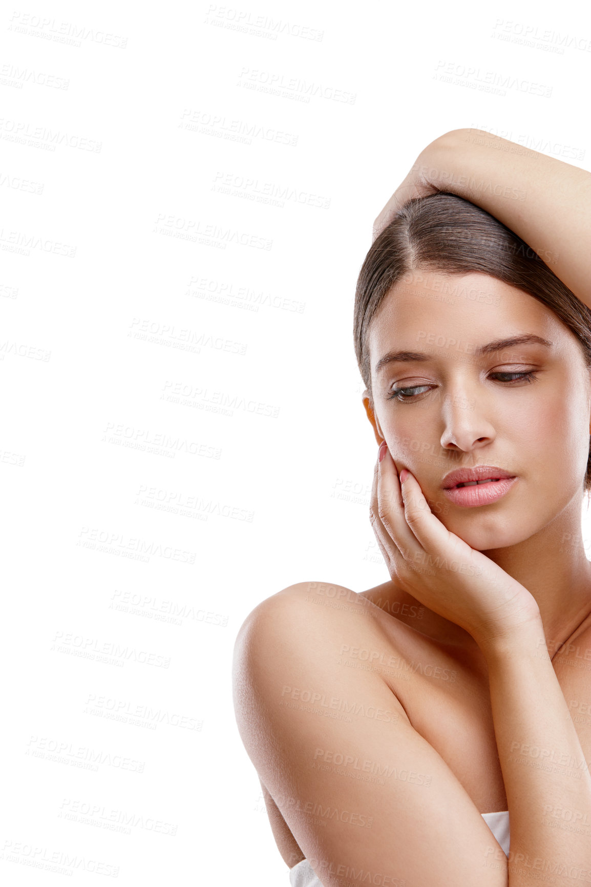 Buy stock photo Cropped studio shot of a beautiful young woman posing against a white background