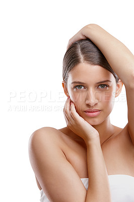 Buy stock photo Cropped studio portrait of a beautiful young woman posing against a white background