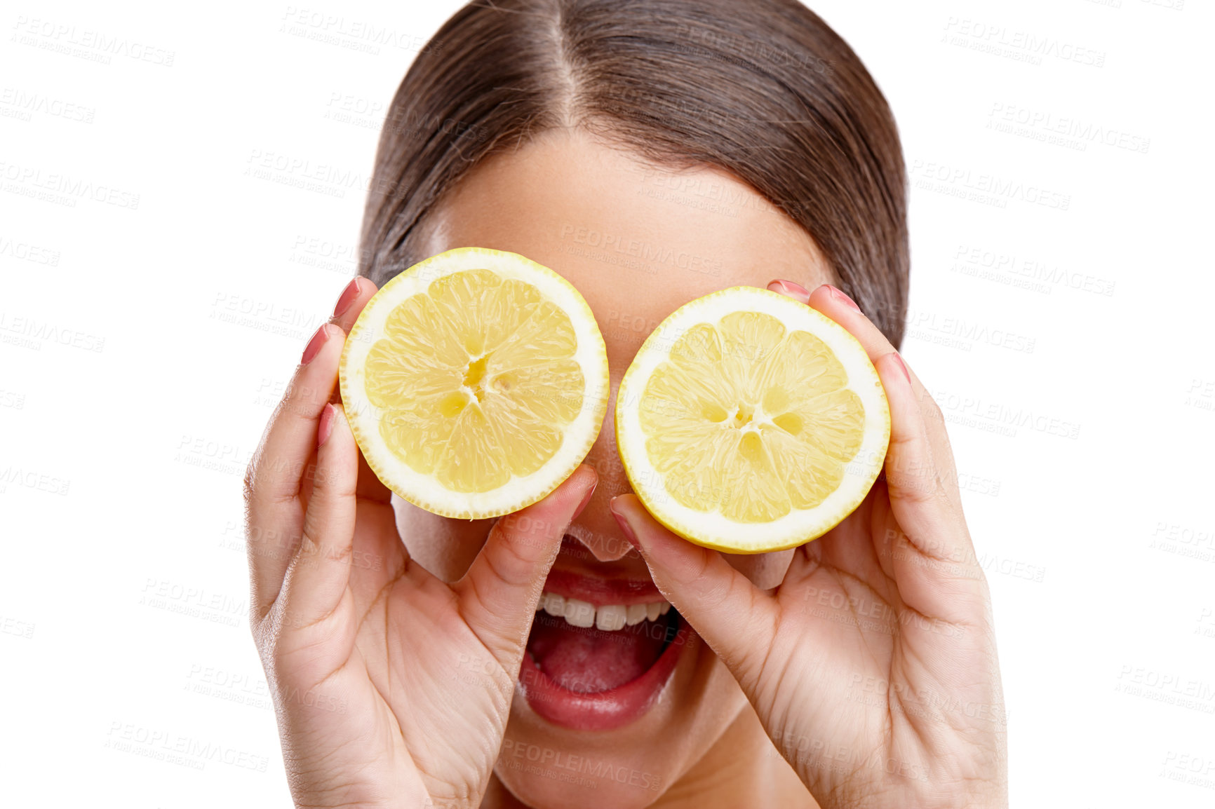 Buy stock photo Studio shot of a young woman holding two halves of a lemon in front of her eyes