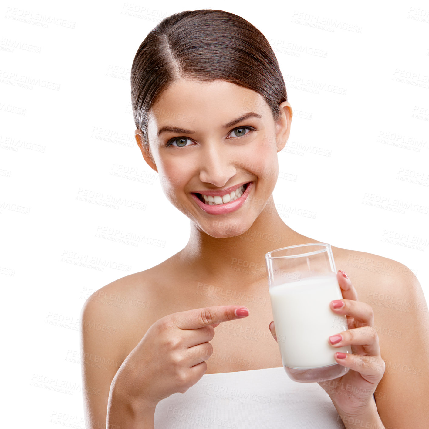 Buy stock photo Woman, milk and point at glass in studio portrait for health, calcium and wellness by white background. Girl, person and model with dairy, happy and benefits with diet choice for nutrition in Italy