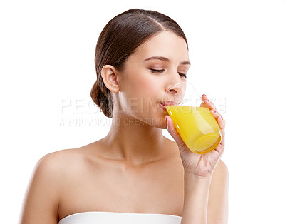 Buy stock photo Skincare, woman and drinking orange juice in studio for wellness, detox diet and vitamin C. Nutritionist, citrus drink or fresh on white background for antioxidants, hydration or vibrant complexion