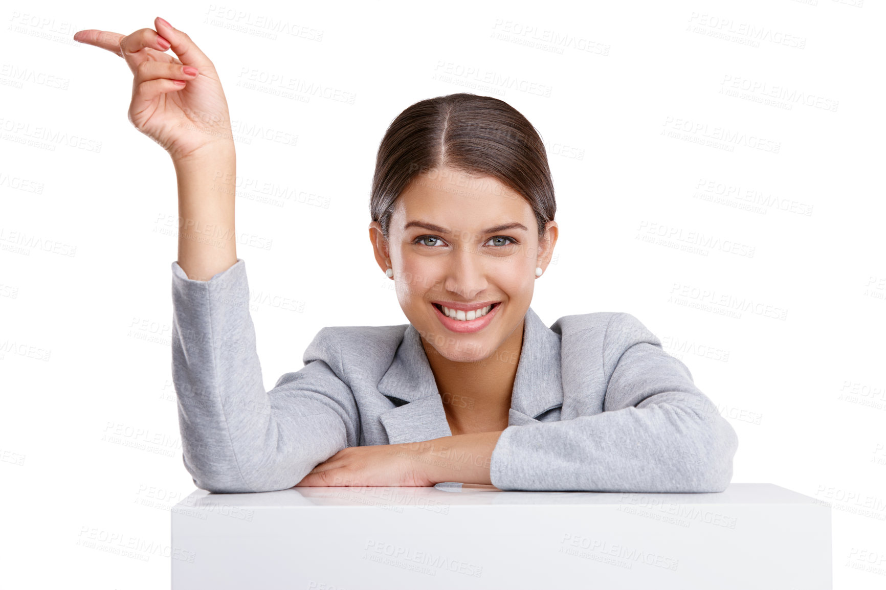 Buy stock photo Studio shot of a beautiful young woman pointing towards something against a white background
