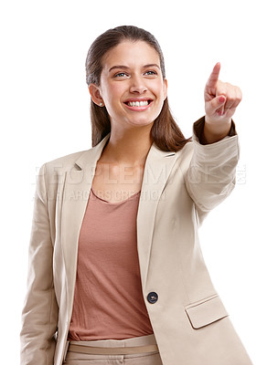Buy stock photo Studio shot of a beautiful young businesswoman pointing towards something against a white background
