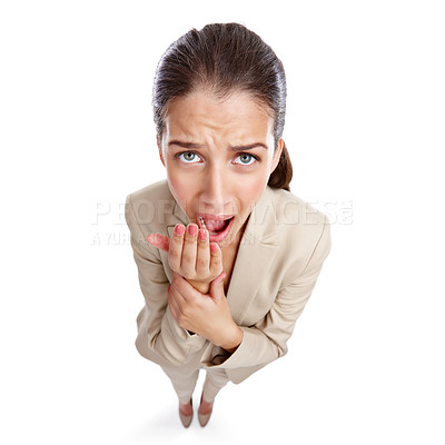 Buy stock photo High angle studio shot of a beautiful young businesswoman yawning against a white background