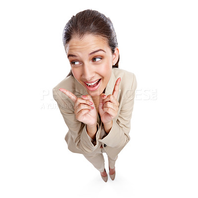 Buy stock photo High angle studio shot of a beautiful young businesswoman pointing towards something against a white background
