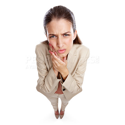 Buy stock photo High angle studio shot of a beautiful young businesswoman experiencing toothache against a white background