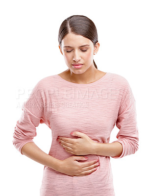 Buy stock photo Studio, digestion and woman stomach pain, sick or endometriosis problem isolated on white background. Sad, angry and frustrated model constipation, belly ache or pancreas risk in advertising mockup