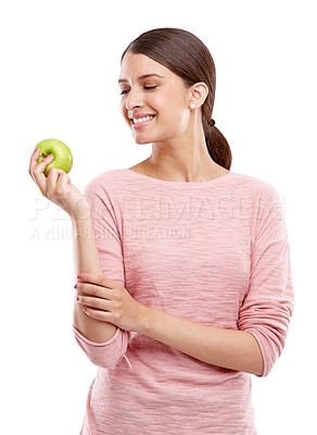 Buy stock photo Health, food and smile with apple with woman for nutrition, diet and weight loss choice. Fiber, care and vitamins with isolated face of girl eating fruit for wellness, organic and natural in studio