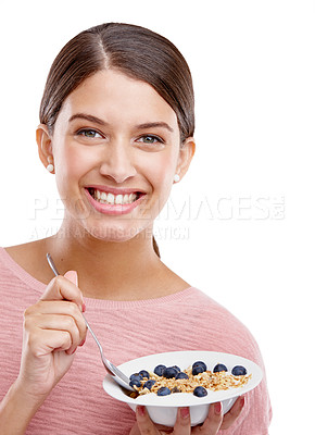 Buy stock photo Happy, woman and smile with healthy bowl of breakfast cereal against a white studio background. Portrait of isolated young female model smiling holding muesli for food health, nutrition or fiber