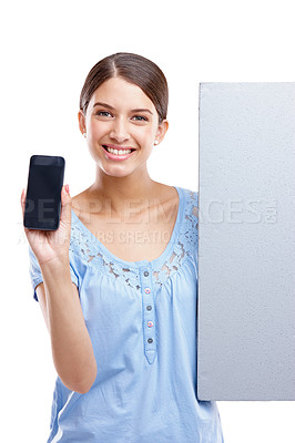 Buy stock photo Portrait, phone and poster with a model woman in studio isolated on a white background for brand advertising. Communication, marketing and mockup with a female posing to promote blank branding space