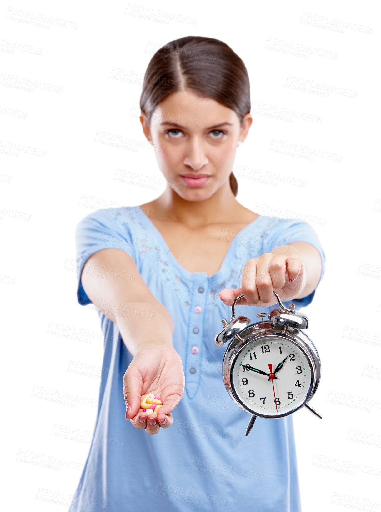 Buy stock photo Medicine, clock and portrait of a patient in a studio waiting to take pills, vitamins or supplements. Tablets, health and young woman with alarm as a medication reminder isolated by white background.