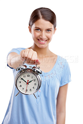 Buy stock photo Portrait, clock and time with a model woman in studio isolated on a white background showing an alarm. Hand, vintage reminder with a female holding an alarm clock or timer on a blank space 