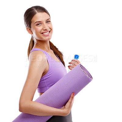 Buy stock photo Studio portrait of a beautiful young woman holding an exercise mat and a bottle of water