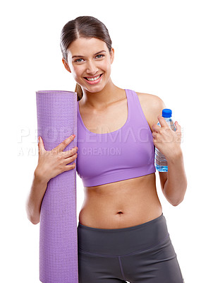 Buy stock photo Shot of a beautiful young woman holding an exercise mat and a bottle of water