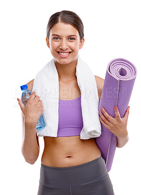 Buy stock photo Shot of a beautiful young woman holding an exercise mat and a bottle of water