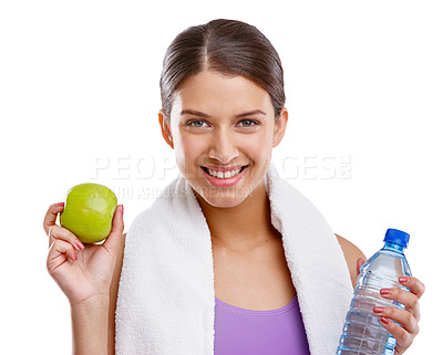 Buy stock photo Shot of a beautiful young woman holding a fresh green apple and a bottle of water