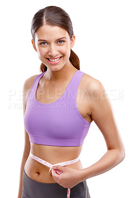 Buy stock photo Portrait of a beautiful woman measuring her waistline
