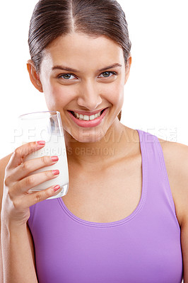 Buy stock photo Portrait of a beautiful woman holding a glass of milk