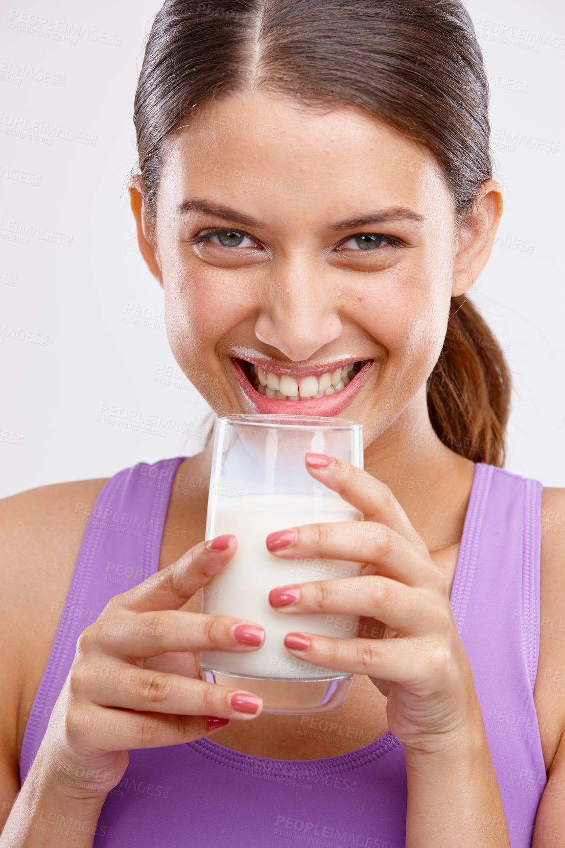 Buy stock photo Health, milk and smile with portrait of woman in studio for calcium, nutrition and diet. Vitamin d, wellness and collagen milkshake with face of person on white background drinking protein smoothie