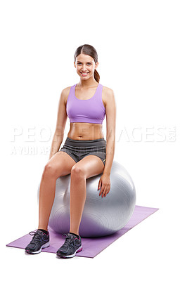 Buy stock photo Shot of a beautiful young woman doing exercises on her fitness ball