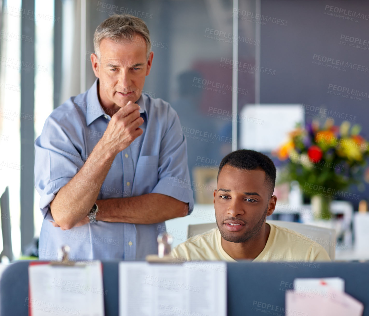 Buy stock photo Shot of two professionals working together in an office