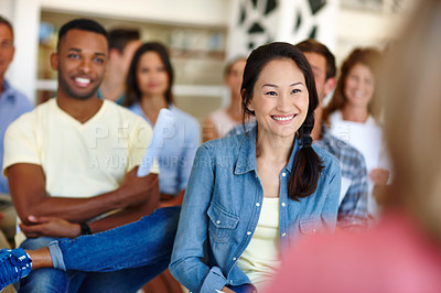 Buy stock photo Shot of coworkers watching a presentation in a casual office environment