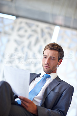 Buy stock photo Business, man and reading document in office for financial report, investment growth and legal contract. Male accountant, review and paperwork for compliance letter, title deed and annual information