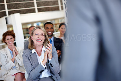 Buy stock photo Shot of a group of colleagues clapping during an office presentation
