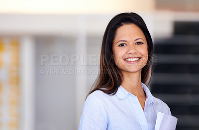 Buy stock photo Portrait of an attractive businesswoman holding paperwork