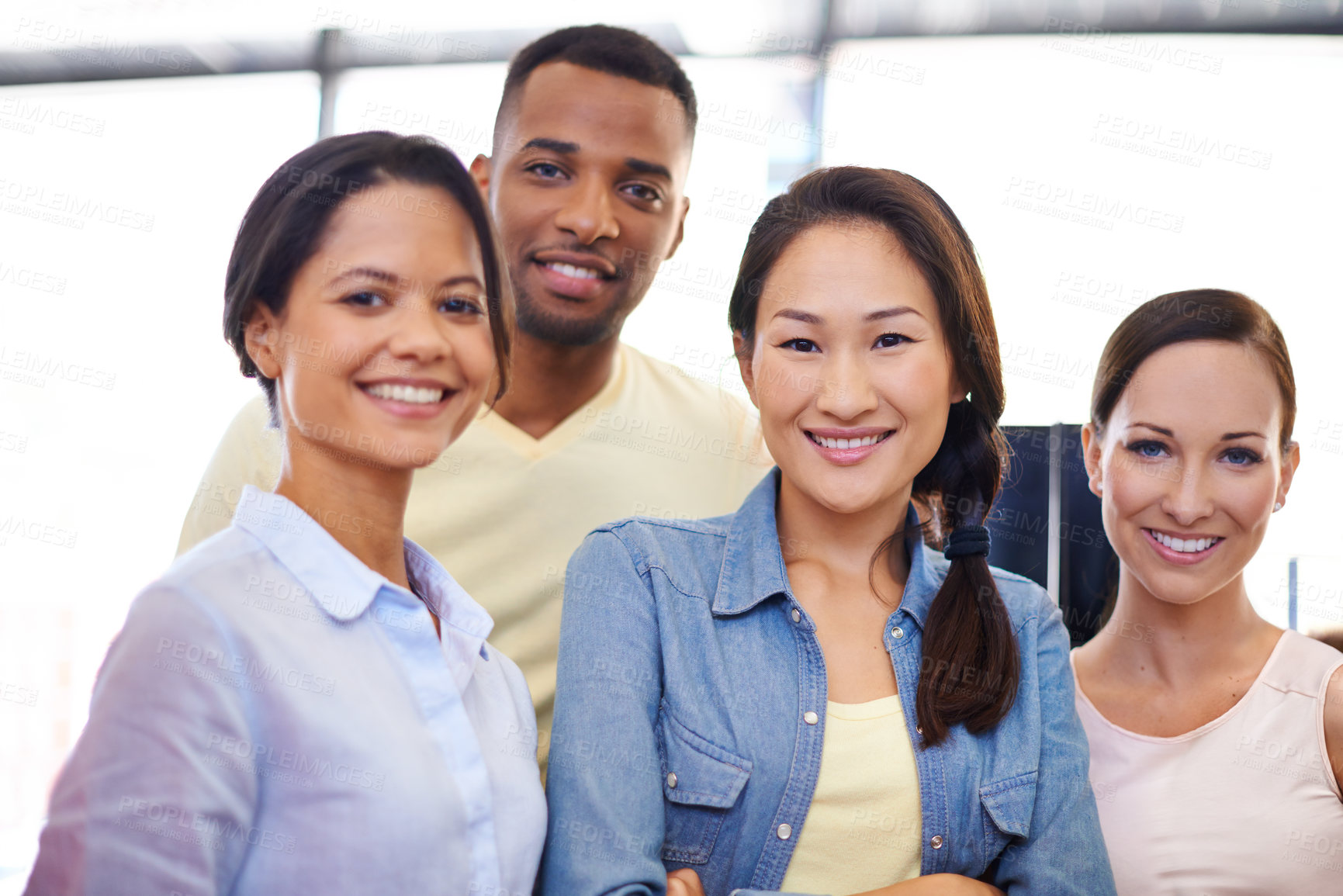 Buy stock photo Portrait of a group of business colleagues in an informal office environment