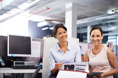 Buy stock photo Portrait of two female designers working together in the office
