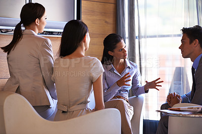 Buy stock photo Shot of a group of business colleagues having a meeting