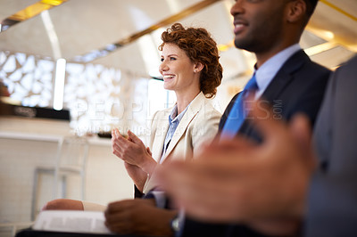 Buy stock photo Cropped shot of a group of businesspeople applauding a work presentation