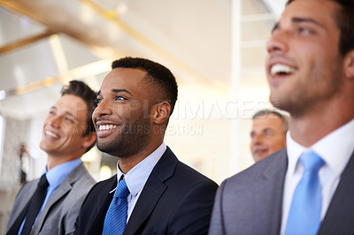 Buy stock photo Cropped shot of a group of businesspeople listening to a work presentation
