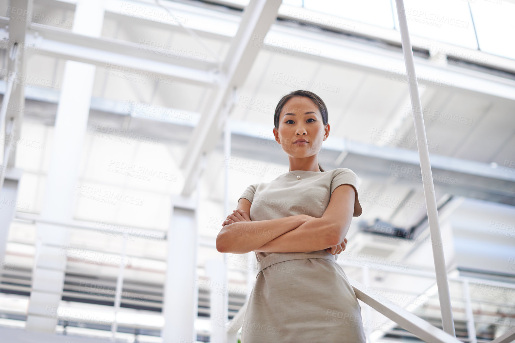 Buy stock photo Business, confidence and portrait of Asian woman in office with ambition, opportunity or pride. Professional, consultant or serious businesswoman in workplace with trust, arms crossed and low angle.