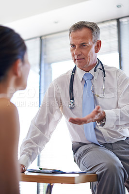 Buy stock photo Hospital, consulting and doctor with woman talking for medical service, help and advice. Healthcare, clinic and man with stethoscope for cardiology treatment in conversation, discussion and results