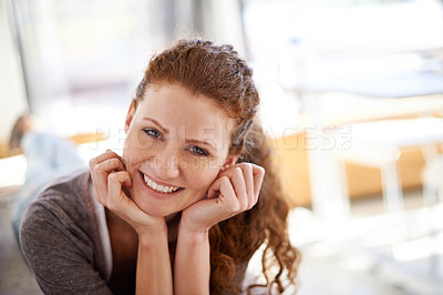 Buy stock photo Portrait of a beautiful woman relaxing on a sofa