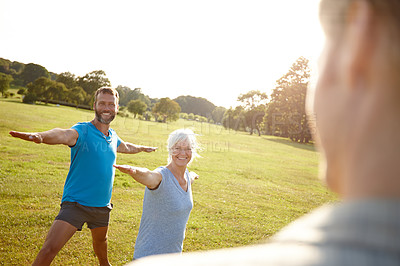 Buy stock photo People, happy and yoga in park for class, wellness or holistic activity for mental health. Mature pilates group, instructor or warrior pose in nature for balance, fitness session or stretching 