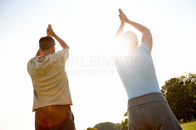 Buy stock photo Namaste, yoga and meditation for team, outdoor and fitness in nature, back or mindfulness of aura. Chakra, lens flare and people in park, wellness and spiritual for peace, soul or together with faith